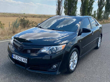 Черный Тойота Камри, объемом двигателя 2.49 л и пробегом 190 тыс. км за 12250 $, фото 1 на Automoto.ua