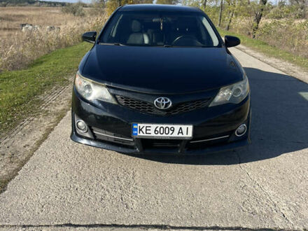 Черный Тойота Камри, объемом двигателя 2.49 л и пробегом 237 тыс. км за 12300 $, фото 1 на Automoto.ua