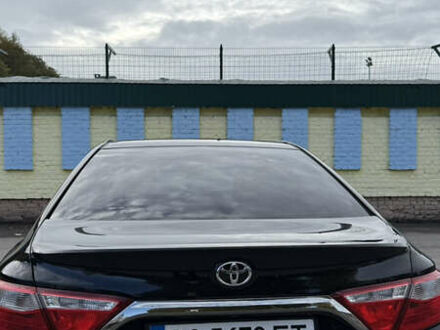 Черный Тойота Камри, объемом двигателя 2.49 л и пробегом 183 тыс. км за 14400 $, фото 1 на Automoto.ua