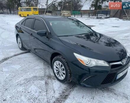 Черный Тойота Камри, объемом двигателя 2.49 л и пробегом 145 тыс. км за 13700 $, фото 1 на Automoto.ua