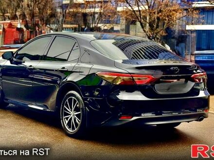 Черный Тойота Камри, объемом двигателя 2.5 л и пробегом 77 тыс. км за 25600 $, фото 1 на Automoto.ua