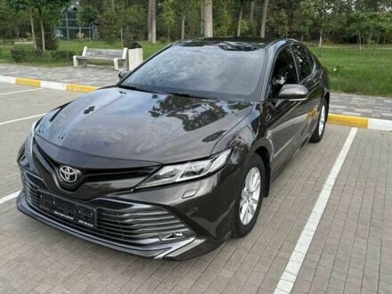 Черный Тойота Камри, объемом двигателя 2.5 л и пробегом 128 тыс. км за 16000 $, фото 1 на Automoto.ua
