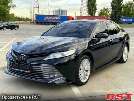 Черный Тойота Камри, объемом двигателя 2.5 л и пробегом 205 тыс. км за 21300 $, фото 1 на Automoto.ua