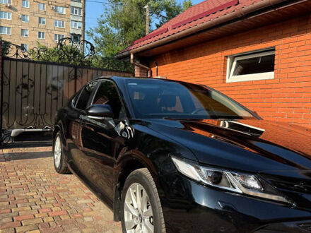 Черный Тойота Камри, объемом двигателя 2.49 л и пробегом 260 тыс. км за 19400 $, фото 1 на Automoto.ua
