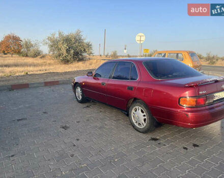 Червоний Тойота Камрі, об'ємом двигуна 2.96 л та пробігом 421 тис. км за 1200 $, фото 1 на Automoto.ua