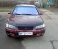 Красный Тойота Камри, объемом двигателя 3 л и пробегом 424 тыс. км за 4500 $, фото 1 на Automoto.ua