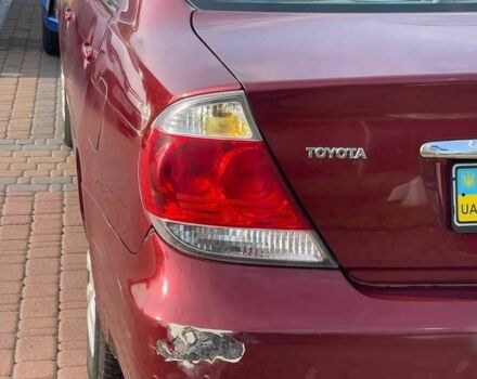 Красный Тойота Камри, объемом двигателя 2.4 л и пробегом 301 тыс. км за 4499 $, фото 6 на Automoto.ua