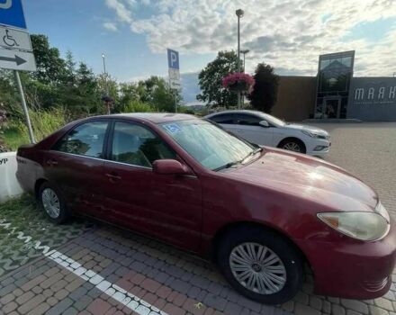 Красный Тойота Камри, объемом двигателя 2.4 л и пробегом 301 тыс. км за 4499 $, фото 11 на Automoto.ua