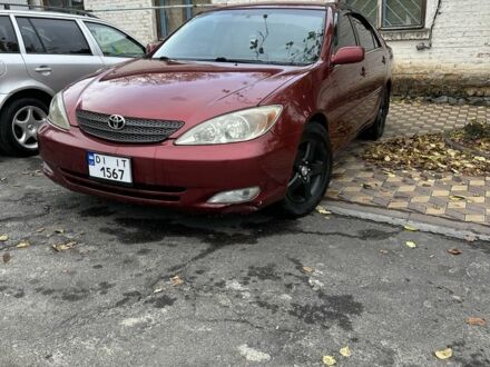 Красный Тойота Камри, объемом двигателя 2.4 л и пробегом 246 тыс. км за 4100 $, фото 1 на Automoto.ua