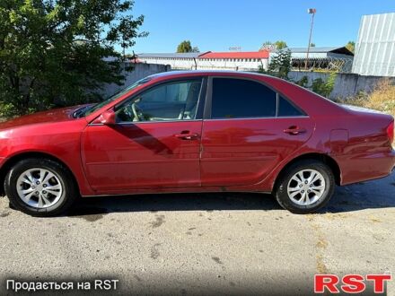 Красный Тойота Камри, объемом двигателя 3 л и пробегом 296 тыс. км за 4000 $, фото 1 на Automoto.ua