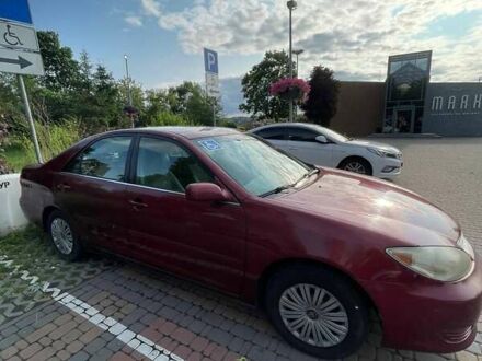 Красный Тойота Камри, объемом двигателя 2.4 л и пробегом 301 тыс. км за 5300 $, фото 1 на Automoto.ua