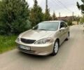 Желтый Тойота Камри, объемом двигателя 2.4 л и пробегом 318 тыс. км за 5400 $, фото 1 на Automoto.ua