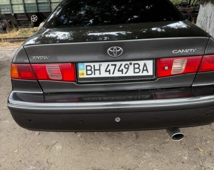 Серый Тойота Камри, объемом двигателя 3 л и пробегом 320 тыс. км за 4000 $, фото 1 на Automoto.ua