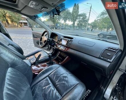 Серый Тойота Камри, объемом двигателя 2.4 л и пробегом 257 тыс. км за 5400 $, фото 32 на Automoto.ua