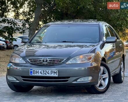 Серый Тойота Камри, объемом двигателя 2.4 л и пробегом 257 тыс. км за 5400 $, фото 69 на Automoto.ua