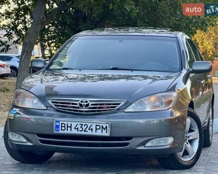 Серый Тойота Камри, объемом двигателя 2.4 л и пробегом 257 тыс. км за 5400 $, фото 2 на Automoto.ua