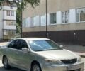 Серый Тойота Камри, объемом двигателя 2.4 л и пробегом 325 тыс. км за 4500 $, фото 1 на Automoto.ua