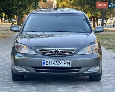 Серый Тойота Камри, объемом двигателя 2.4 л и пробегом 257 тыс. км за 5400 $, фото 1 на Automoto.ua