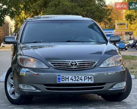 Серый Тойота Камри, объемом двигателя 2.4 л и пробегом 257 тыс. км за 5400 $, фото 66 на Automoto.ua