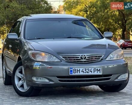 Серый Тойота Камри, объемом двигателя 2.4 л и пробегом 257 тыс. км за 5400 $, фото 67 на Automoto.ua