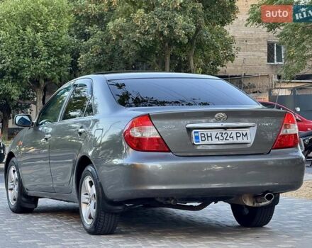 Серый Тойота Камри, объемом двигателя 2.4 л и пробегом 257 тыс. км за 5400 $, фото 60 на Automoto.ua