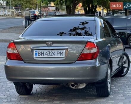 Серый Тойота Камри, объемом двигателя 2.4 л и пробегом 257 тыс. км за 5400 $, фото 57 на Automoto.ua