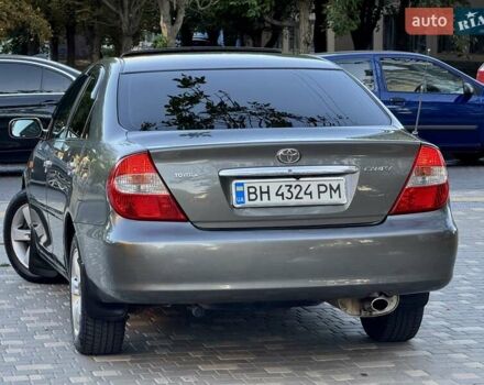 Серый Тойота Камри, объемом двигателя 2.4 л и пробегом 257 тыс. км за 5400 $, фото 78 на Automoto.ua