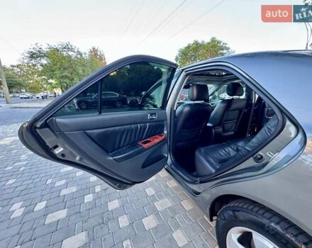 Серый Тойота Камри, объемом двигателя 2.4 л и пробегом 257 тыс. км за 5400 $, фото 23 на Automoto.ua