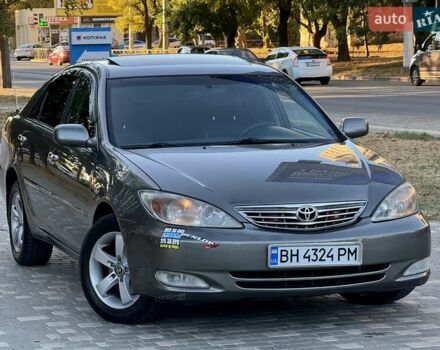 Серый Тойота Камри, объемом двигателя 2.4 л и пробегом 257 тыс. км за 5400 $, фото 79 на Automoto.ua