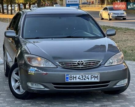 Серый Тойота Камри, объемом двигателя 2.4 л и пробегом 257 тыс. км за 5400 $, фото 62 на Automoto.ua