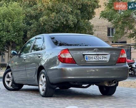 Серый Тойота Камри, объемом двигателя 2.4 л и пробегом 257 тыс. км за 5400 $, фото 56 на Automoto.ua