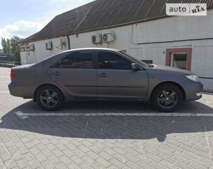 Серый Тойота Камри, объемом двигателя 3 л и пробегом 406 тыс. км за 5500 $, фото 3 на Automoto.ua