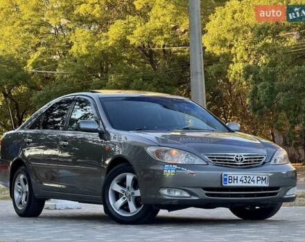 Серый Тойота Камри, объемом двигателя 2.4 л и пробегом 257 тыс. км за 5400 $, фото 65 на Automoto.ua