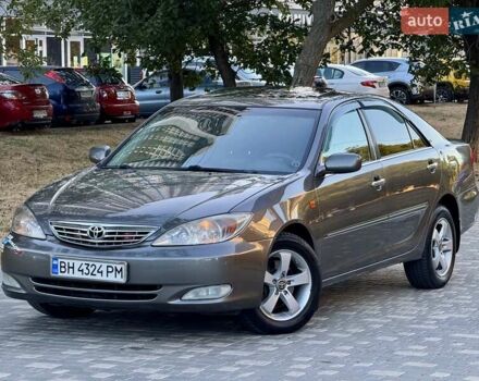 Серый Тойота Камри, объемом двигателя 2.4 л и пробегом 257 тыс. км за 5400 $, фото 71 на Automoto.ua