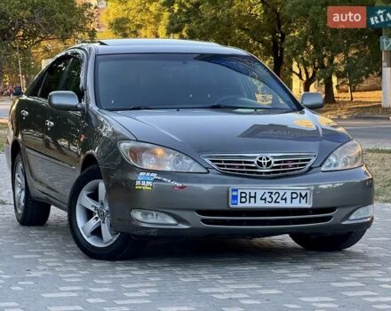 Серый Тойота Камри, объемом двигателя 2.4 л и пробегом 257 тыс. км за 5400 $, фото 61 на Automoto.ua