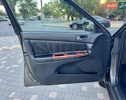 Серый Тойота Камри, объемом двигателя 2.4 л и пробегом 257 тыс. км за 5400 $, фото 77 на Automoto.ua