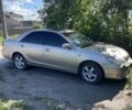 Сірий Тойота Камрі, об'ємом двигуна 3 л та пробігом 389 тис. км за 5300 $, фото 1 на Automoto.ua
