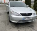 Сірий Тойота Камрі, об'ємом двигуна 2.4 л та пробігом 320 тис. км за 5500 $, фото 1 на Automoto.ua