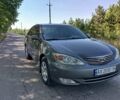 Серый Тойота Камри, объемом двигателя 2.4 л и пробегом 315 тыс. км за 6100 $, фото 1 на Automoto.ua