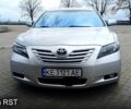 Серый Тойота Камри, объемом двигателя 2.4 л и пробегом 300 тыс. км за 7500 $, фото 1 на Automoto.ua