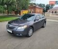 Серый Тойота Камри, объемом двигателя 2.4 л и пробегом 243 тыс. км за 8300 $, фото 1 на Automoto.ua