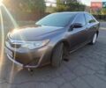 Серый Тойота Камри, объемом двигателя 2.49 л и пробегом 250 тыс. км за 12200 $, фото 1 на Automoto.ua