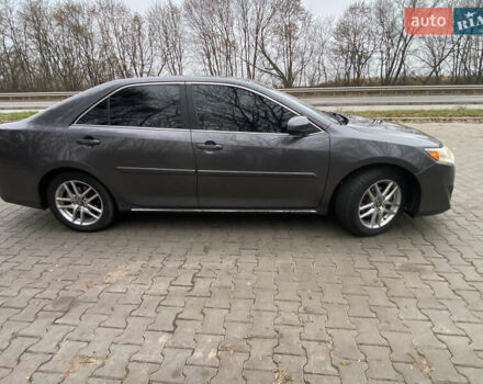 Сірий Тойота Камрі, об'ємом двигуна 2.4 л та пробігом 241 тис. км за 12600 $, фото 2 на Automoto.ua