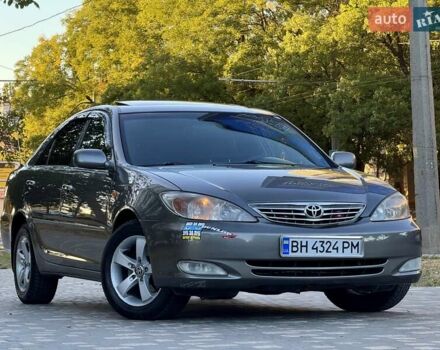 Серый Тойота Камри, объемом двигателя 2.4 л и пробегом 257 тыс. км за 5400 $, фото 1 на Automoto.ua