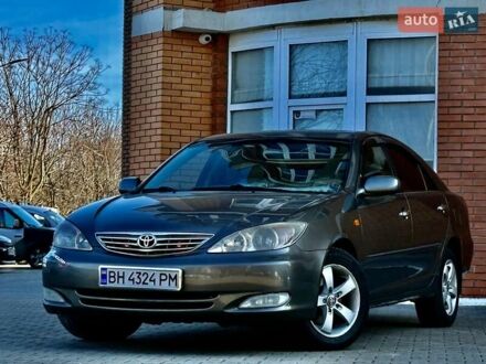 Сірий Тойота Камрі, об'ємом двигуна 2.4 л та пробігом 257 тис. км за 5400 $, фото 1 на Automoto.ua