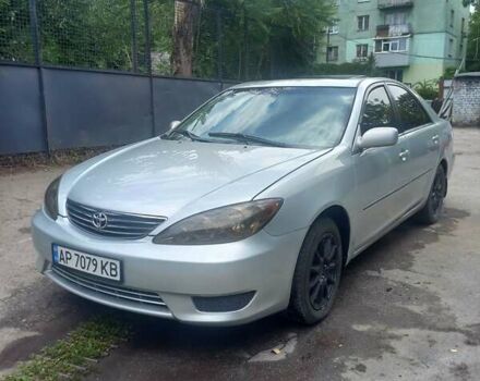 Серый Тойота Камри, объемом двигателя 3 л и пробегом 290 тыс. км за 4250 $, фото 1 на Automoto.ua