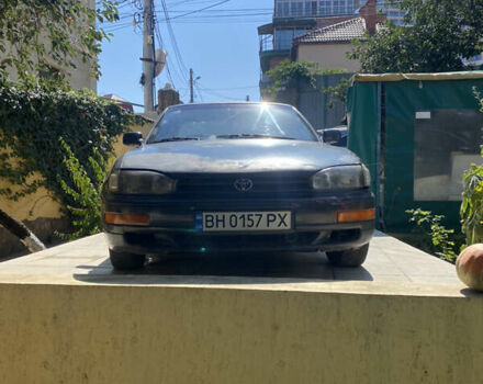 Синий Тойота Камри, объемом двигателя 2.96 л и пробегом 362 тыс. км за 1750 $, фото 1 на Automoto.ua
