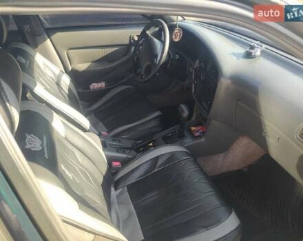 Зеленый Тойота Камри, объемом двигателя 3 л и пробегом 347 тыс. км за 2800 $, фото 3 на Automoto.ua