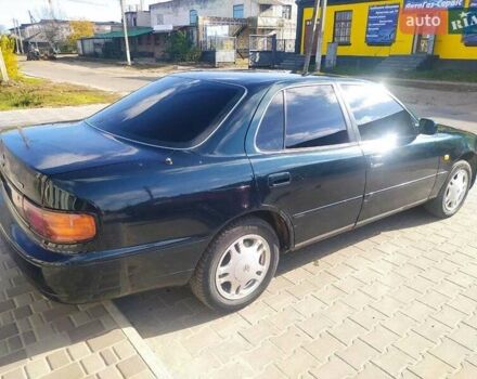 Зеленый Тойота Камри, объемом двигателя 3 л и пробегом 347 тыс. км за 2800 $, фото 1 на Automoto.ua