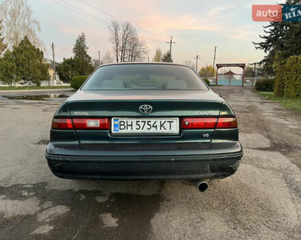 Зеленый Тойота Камри, объемом двигателя 3 л и пробегом 355 тыс. км за 3400 $, фото 4 на Automoto.ua